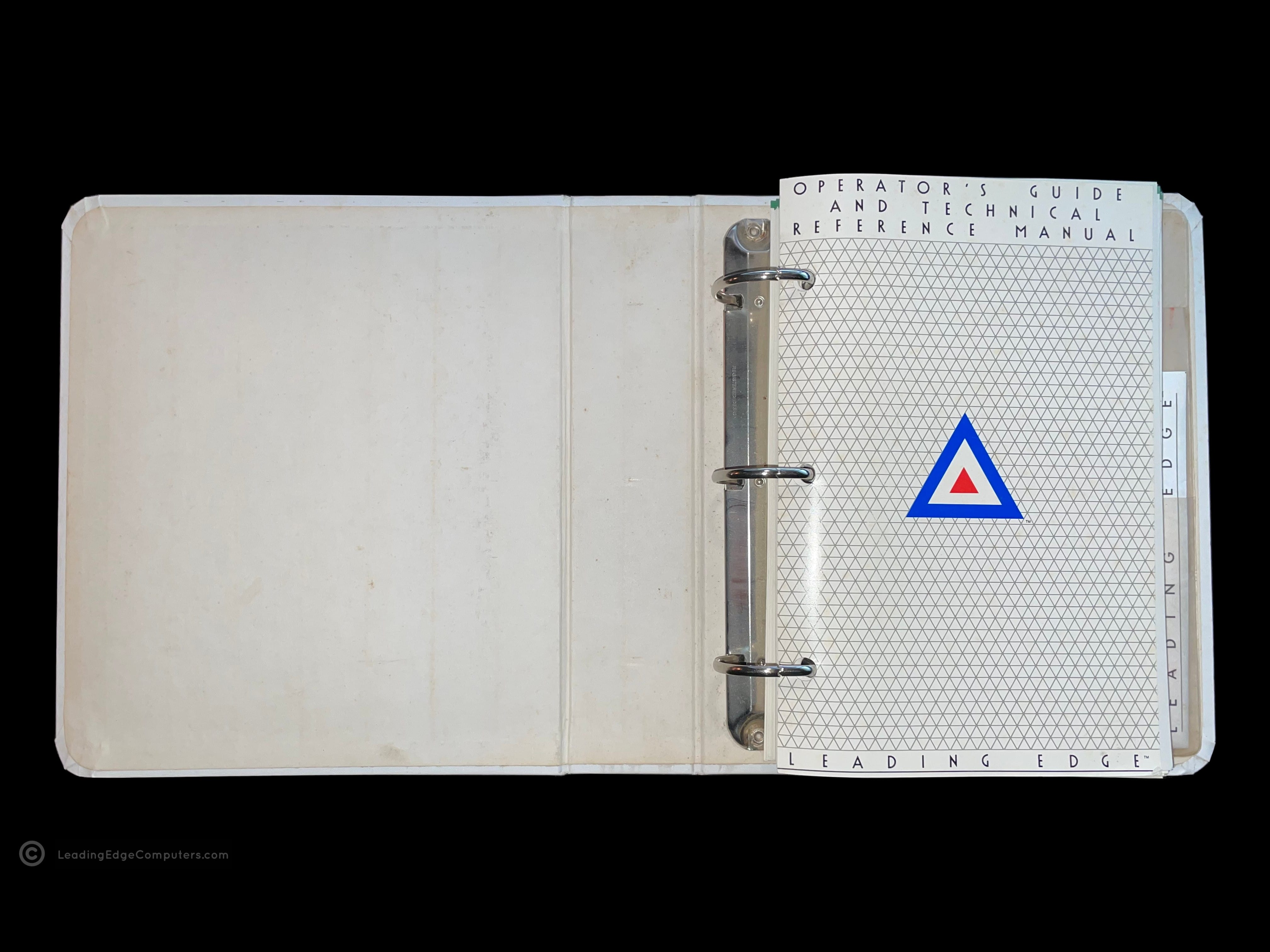 A photo of the Leading Edge Operator's Guide Technical Reference Manual opened to the title page